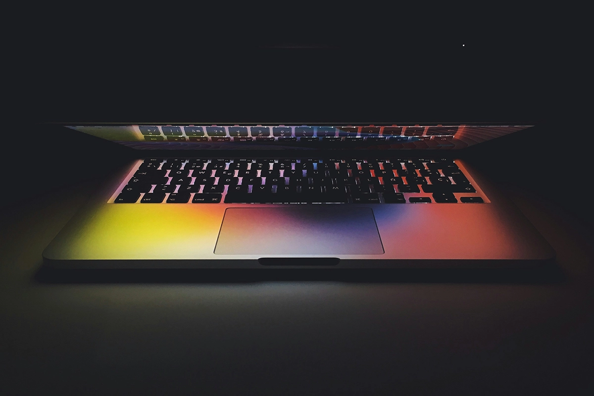 a laptop with a rainbow colored keyboard